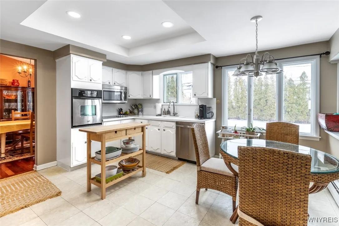 The bright eat in kitchen has built in oven, microwave and cooktop.