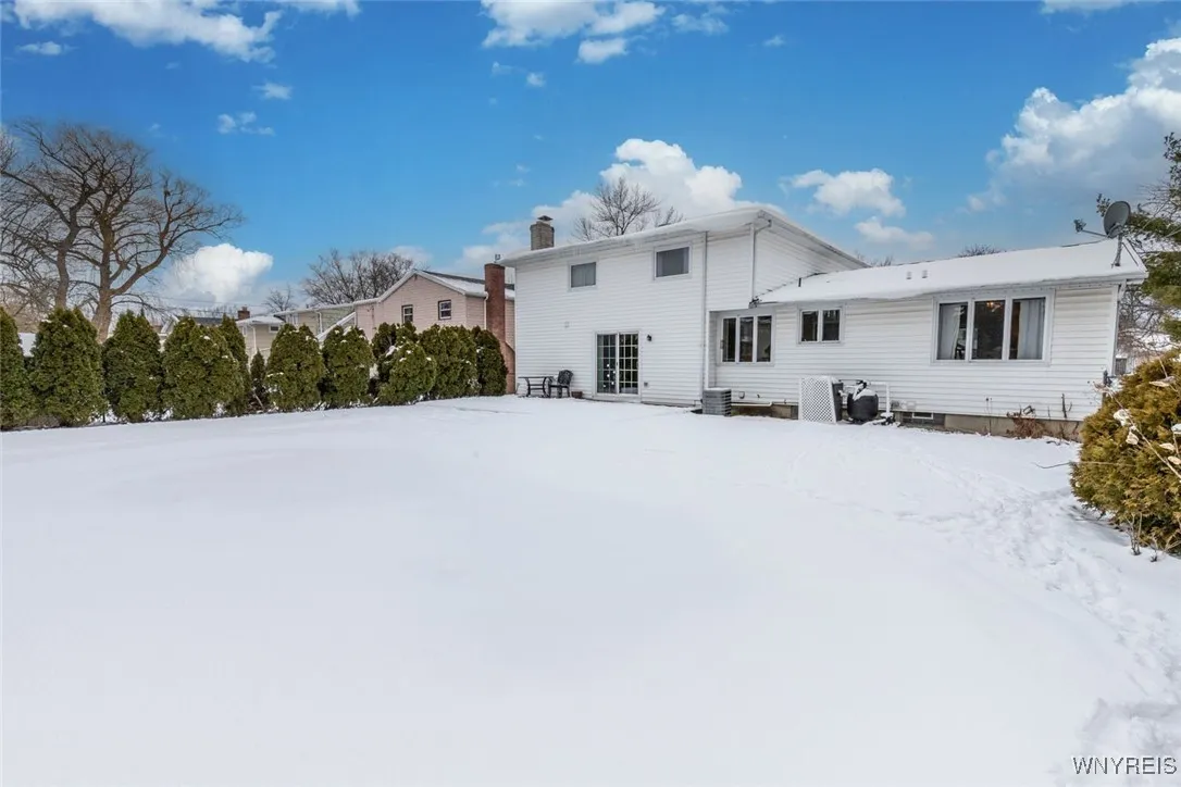 Beautiful fully fenced backyard with in ground pool.
