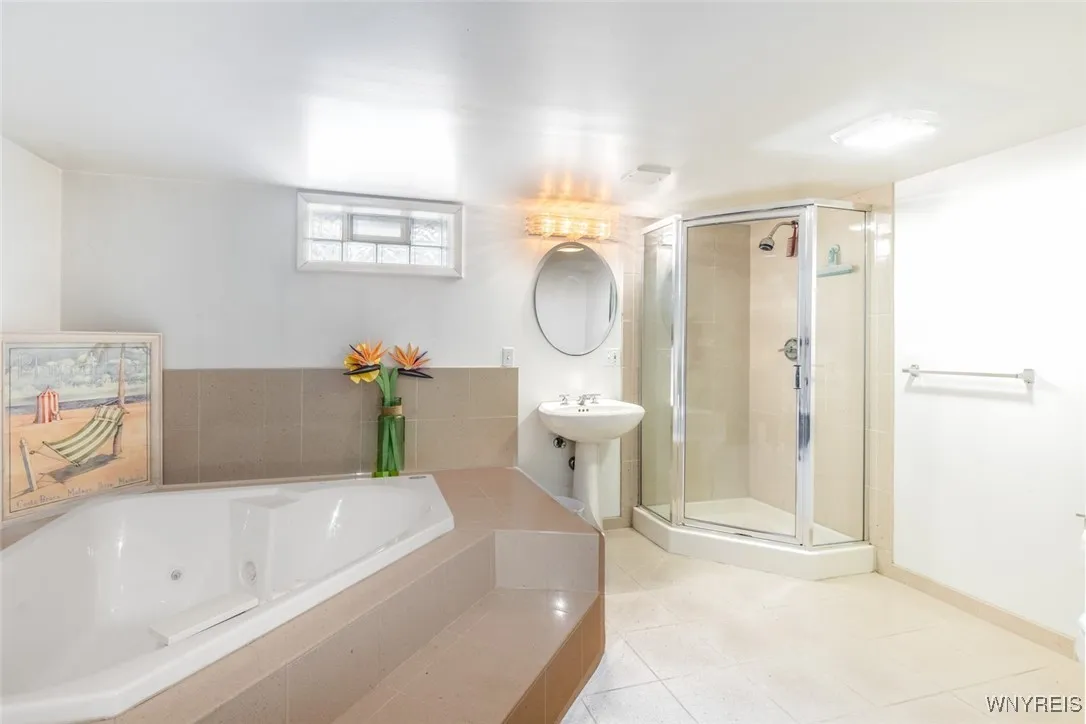 What a nice bonus! A huge basement full bath with a large whirlpool tub plus a wall in shower.
