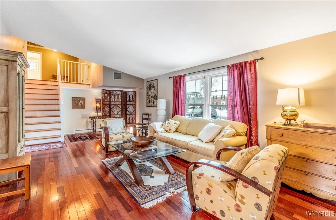 The beautiful hardwood floors that were refinished and beautifully maintained flow seamlessly throughout this room and the dining room.