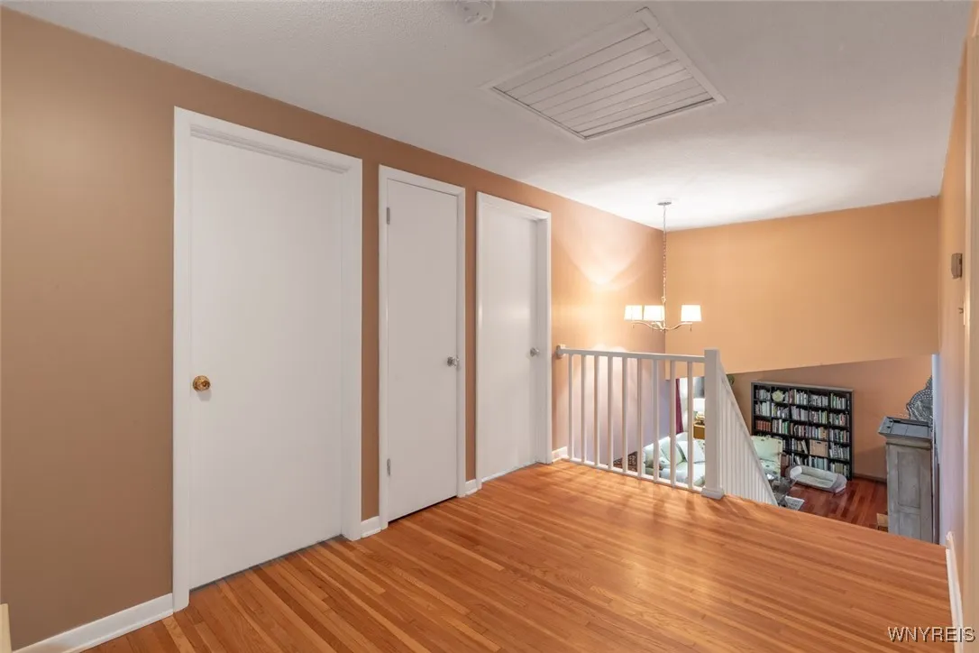 The small room sized second floor upper hallway has an open and pretty view of the living room below. There are 4 large bedrooms and two full bathrooms on this level.