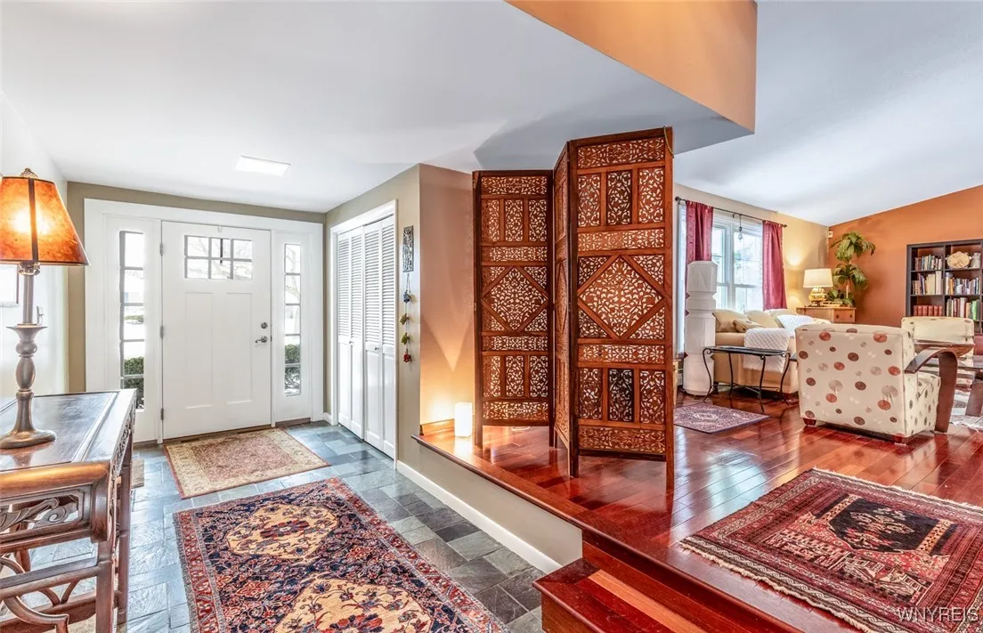 Pretty view of the foyer entryway leading to the living room.