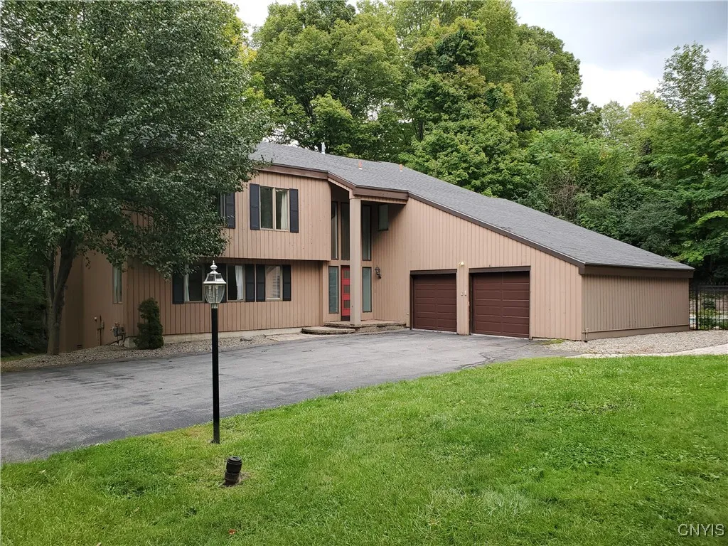 Welcome to 7001 Tiffany Circle in beautiful Lymestone Hill.  This fabulous contemporary home is in the acclaimed Jamesville Dewitt School District and features a private back yard with a shimmering heated in-ground pool.