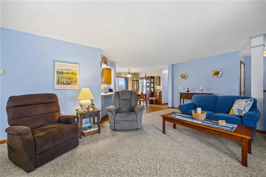 Spacious living room with easy access to dining and kitchen