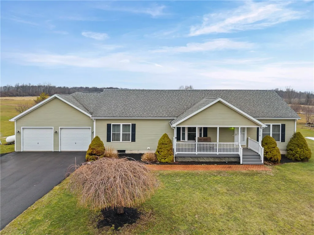 Nice porch on front of home, well maintained easy maintenance yard