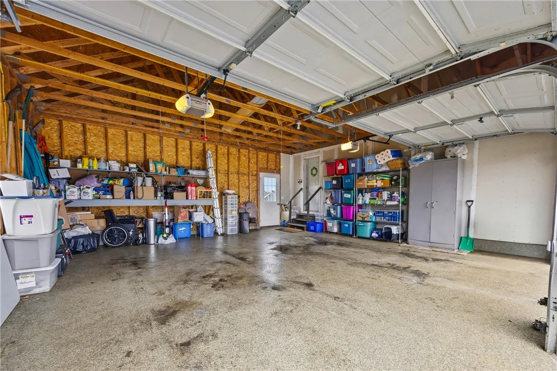 Garage with epoxy floors and space for storage