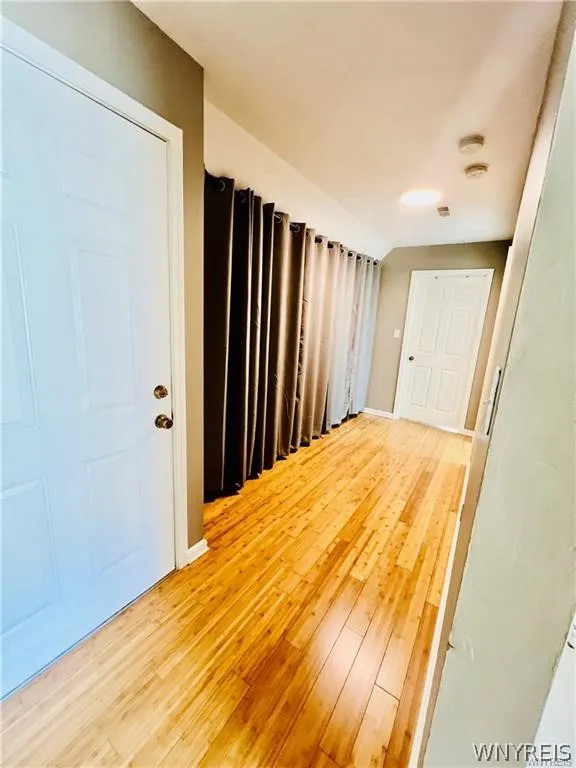 hall way with huge closet and storage enclosed
