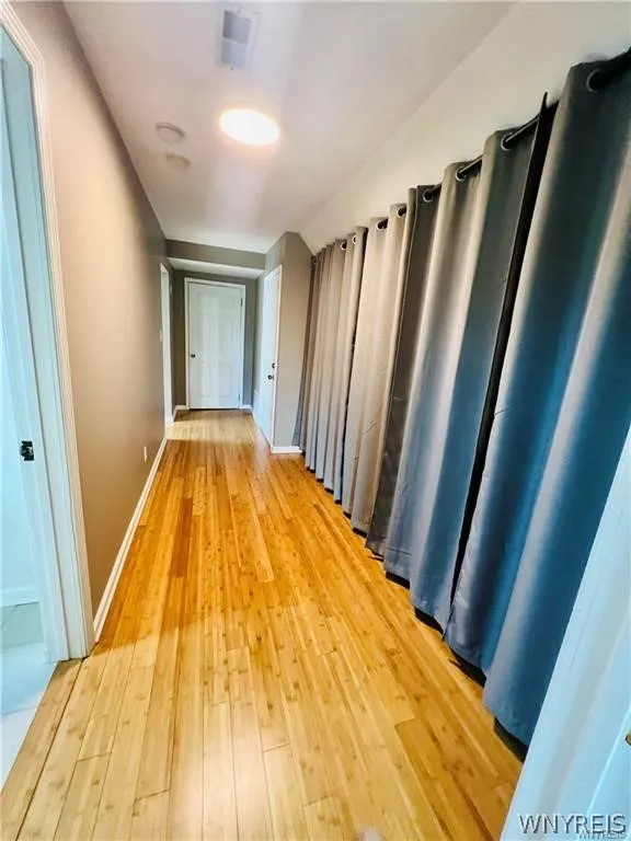 hallway with closet and storage