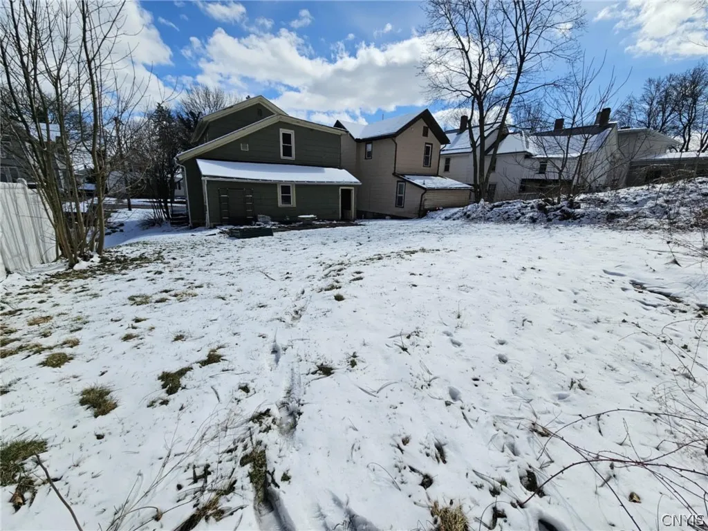 View from corner edge of back yard facing house.