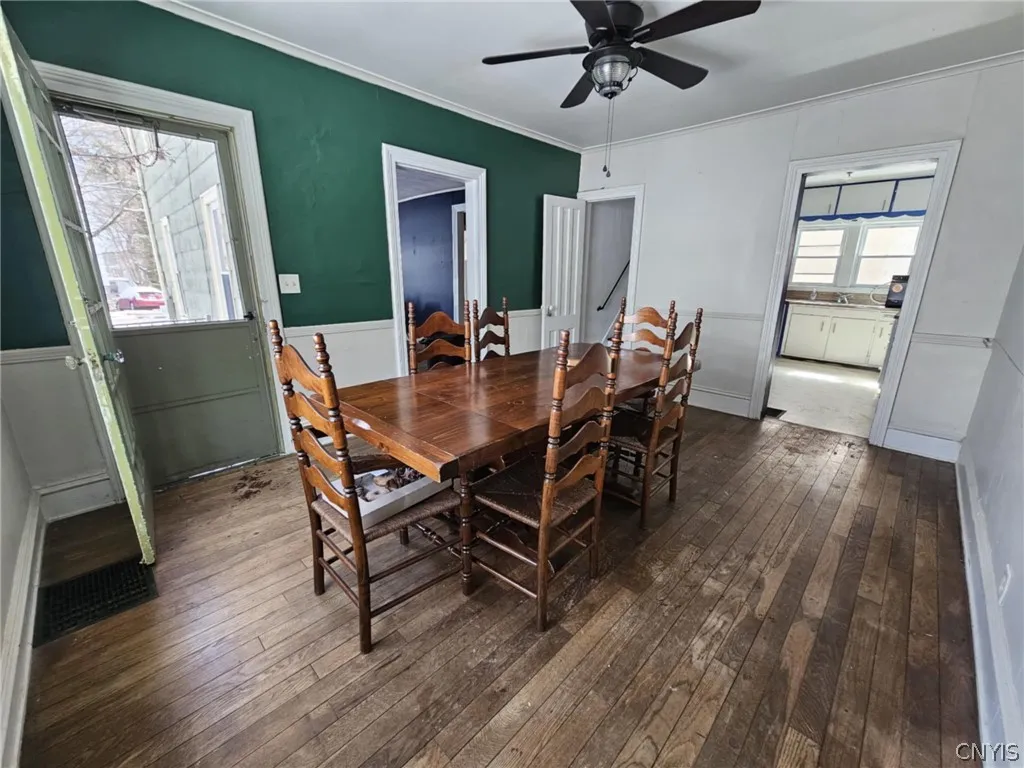 Dining room facing side patio door.