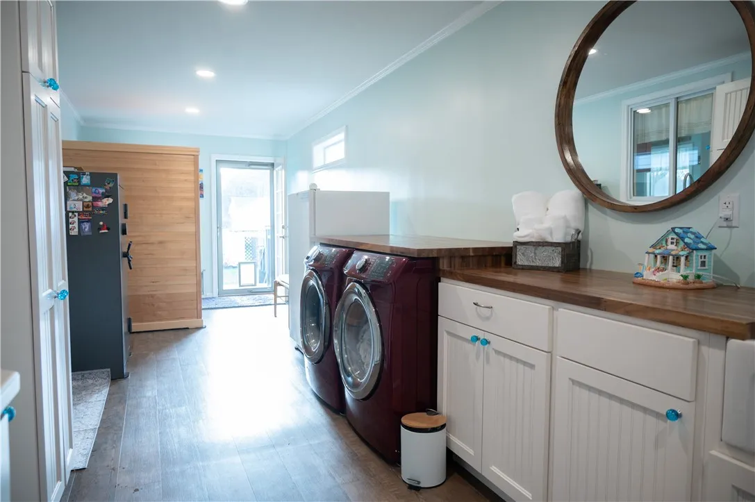Laundry room with the sauna and another entrance to the back yard.  Perfect for coming in from the pool
