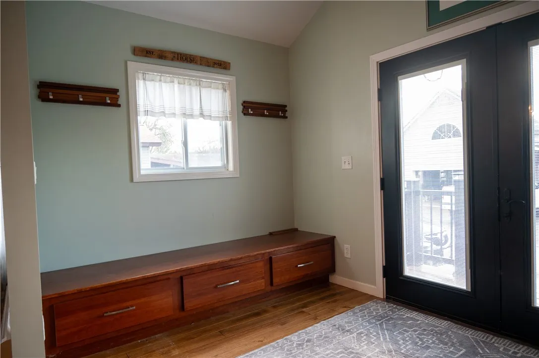 Mud room area by the French style back door entrance