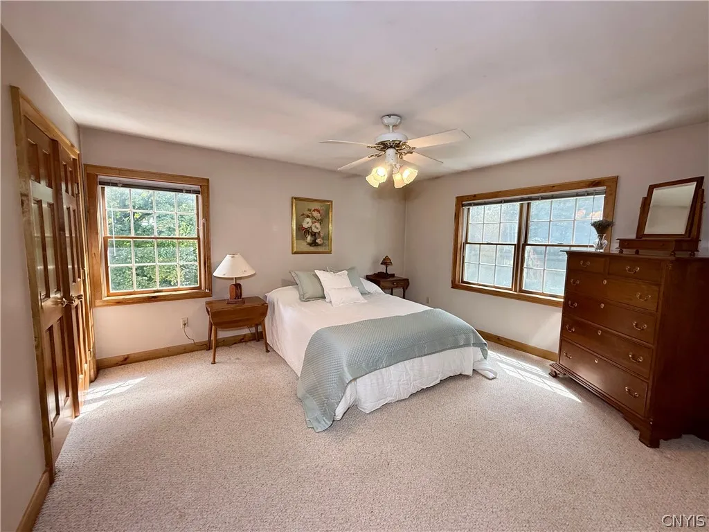 Private in-law quarters above the garage, complete with its own living room, bedroom, and full bath.
