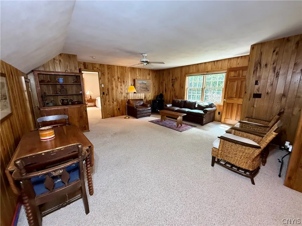 Private in-law quarters above the garage, complete with its own living room, bedroom, and full bath.