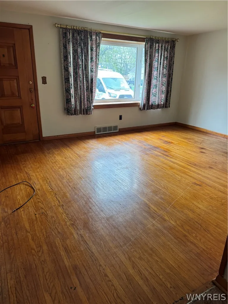 Living room with bay window and hardwood floor