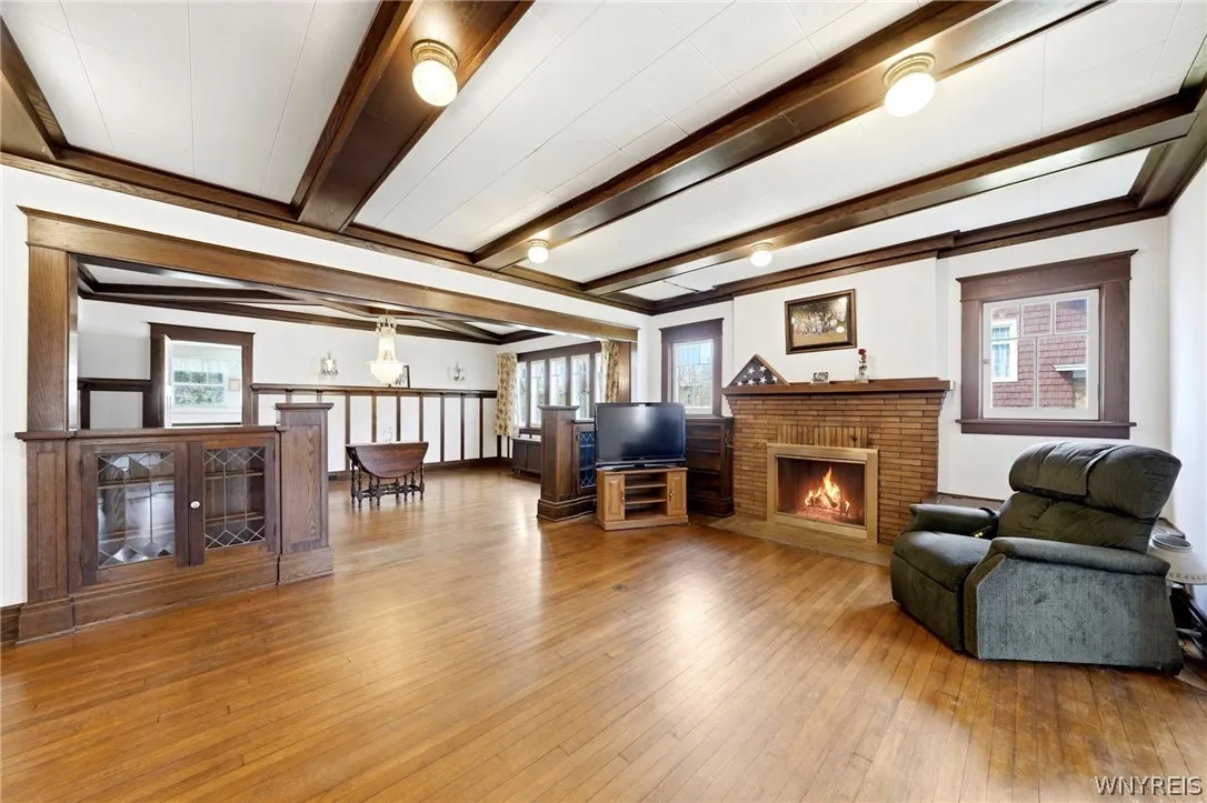 Rich 1917 woodwork and beautifully crafted built-in cabinetry lead to an elegant formal dining room