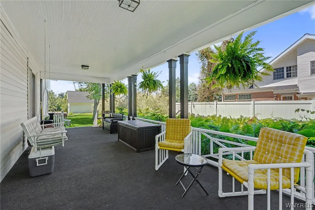 PILLARED VERANDA ALOMNG SIDE OF HOME