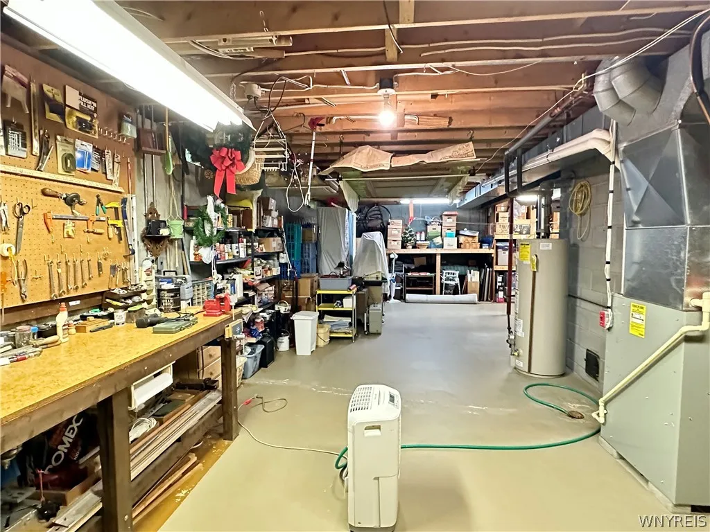 Basement-The dedicated workshop area & abundant storage space provides room for projects, seasonal items & organization.