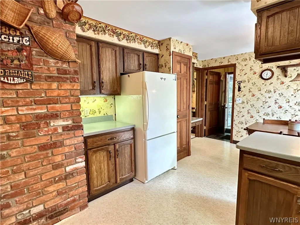 Next to the refrigerator is a pantry.