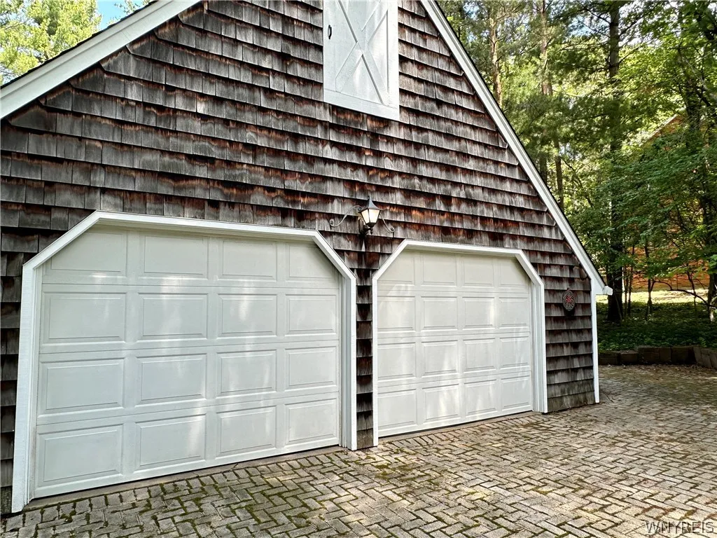 New England feeling shingle shake exterior! 2.5 car garage with storage.
