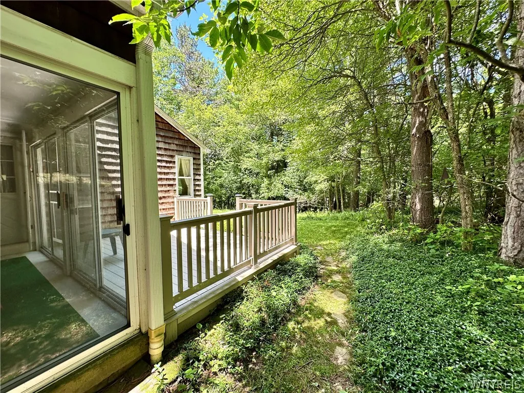 Porch & deck connected with sliding glass door.