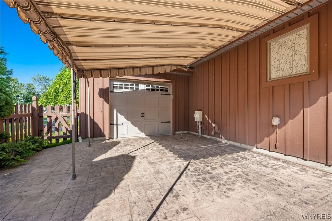 covered Patio, entrance to the 3rd garage bay