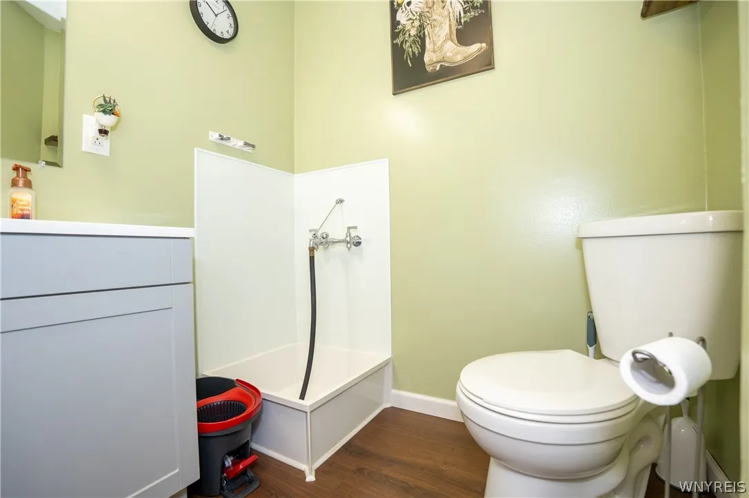 Half bath with raised utility wash station