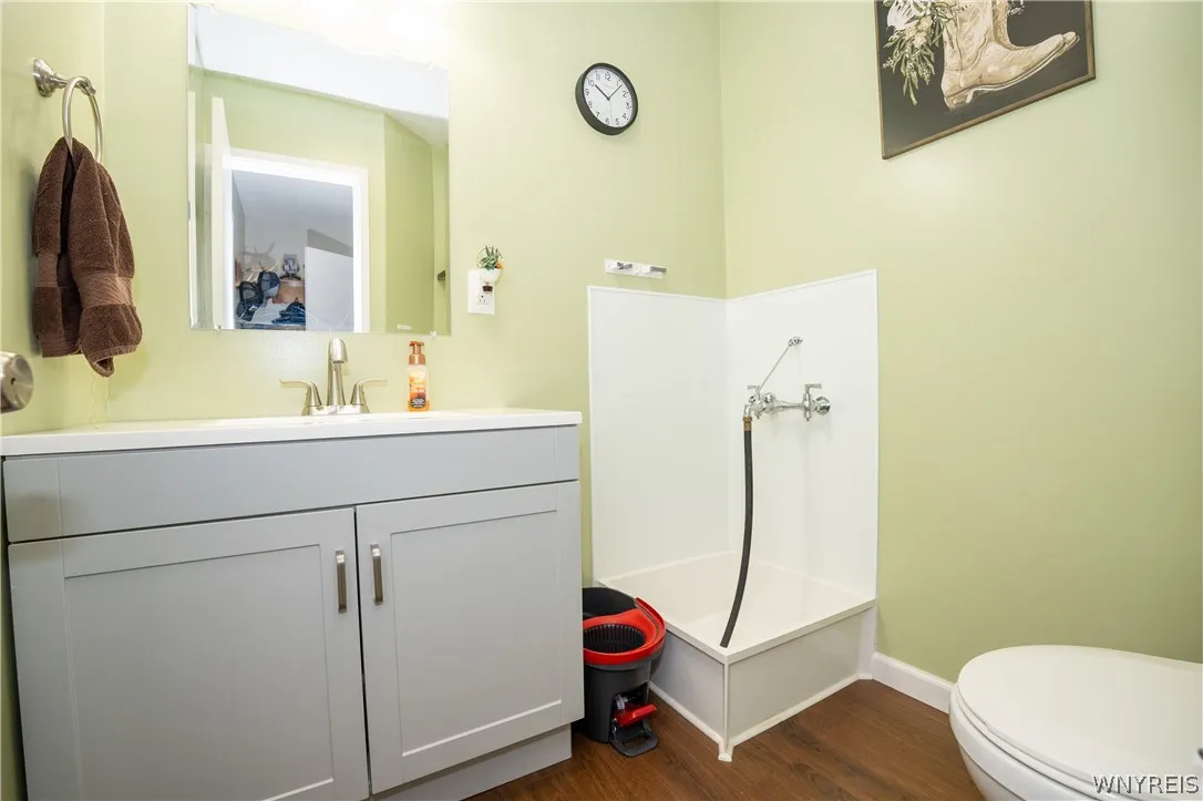 Half bath with raised utility wash station