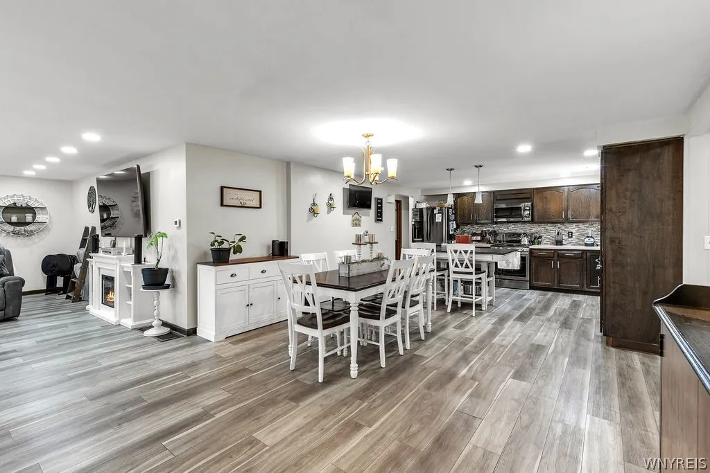 Wide open front living room, dining room, kitchen.