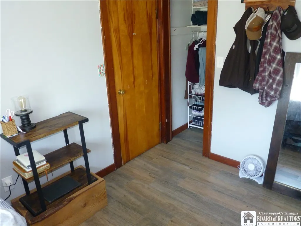 Bedroom #1 with closet and wood floors