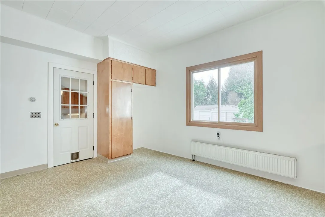 KITCHEN - DOOR TO MUDROOM, BASEMENT STAIRS, & 2-CAR GARAGE
