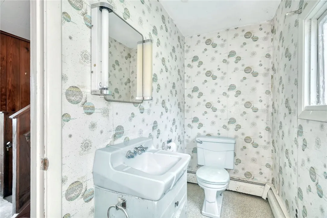 HALF BATH OFF OF THE KITCHEN