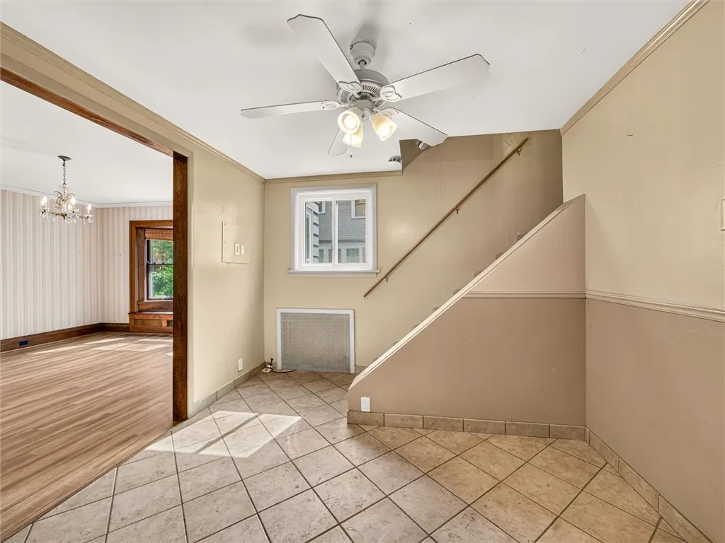 Dinette area of kitchen and rear staircase to 2nd floor