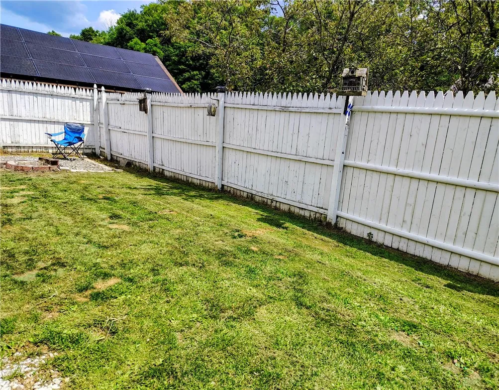 Full Fenced in area with fire pit
