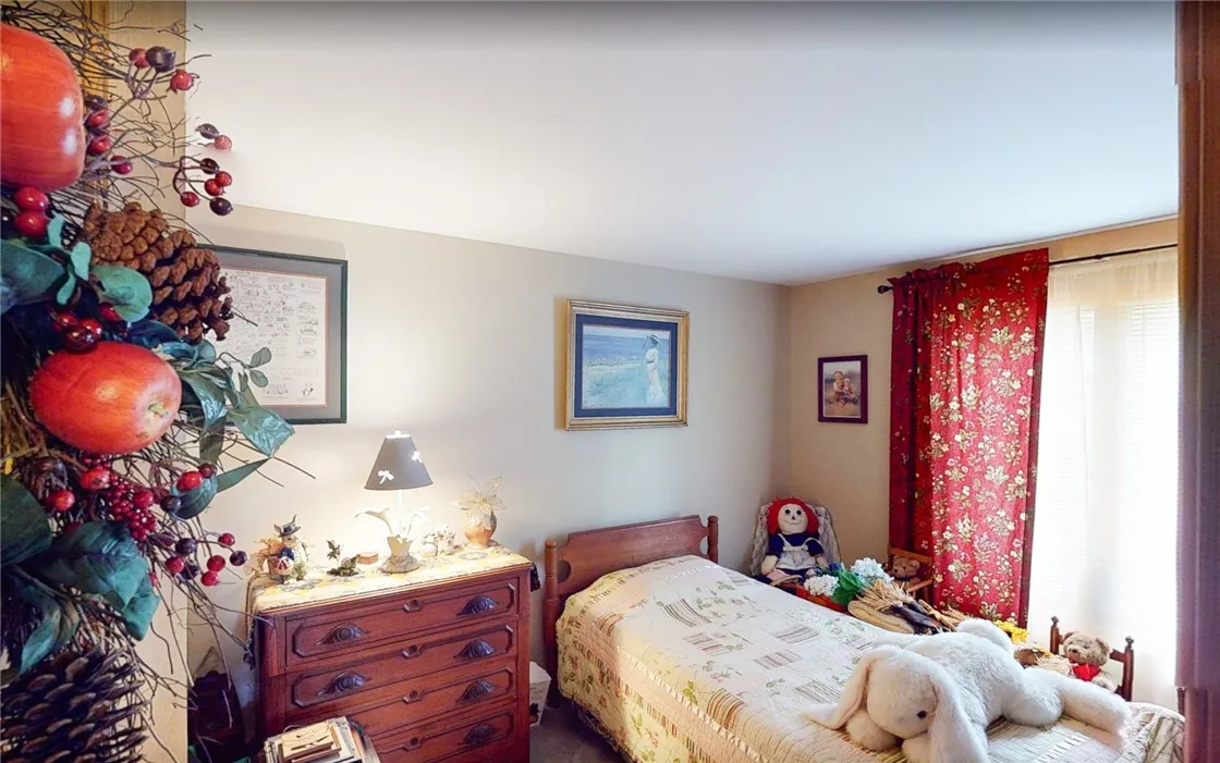 Smaller 1st floor bedroom with wall to wall carpet
