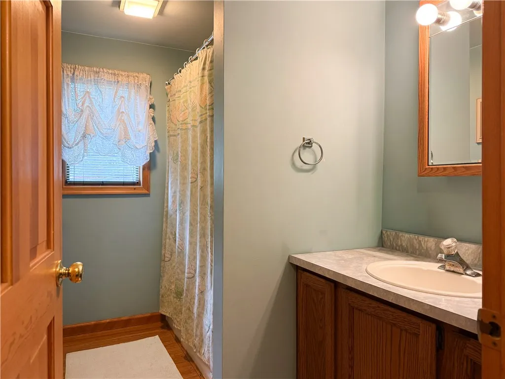 Main floor full bath with wood floors
