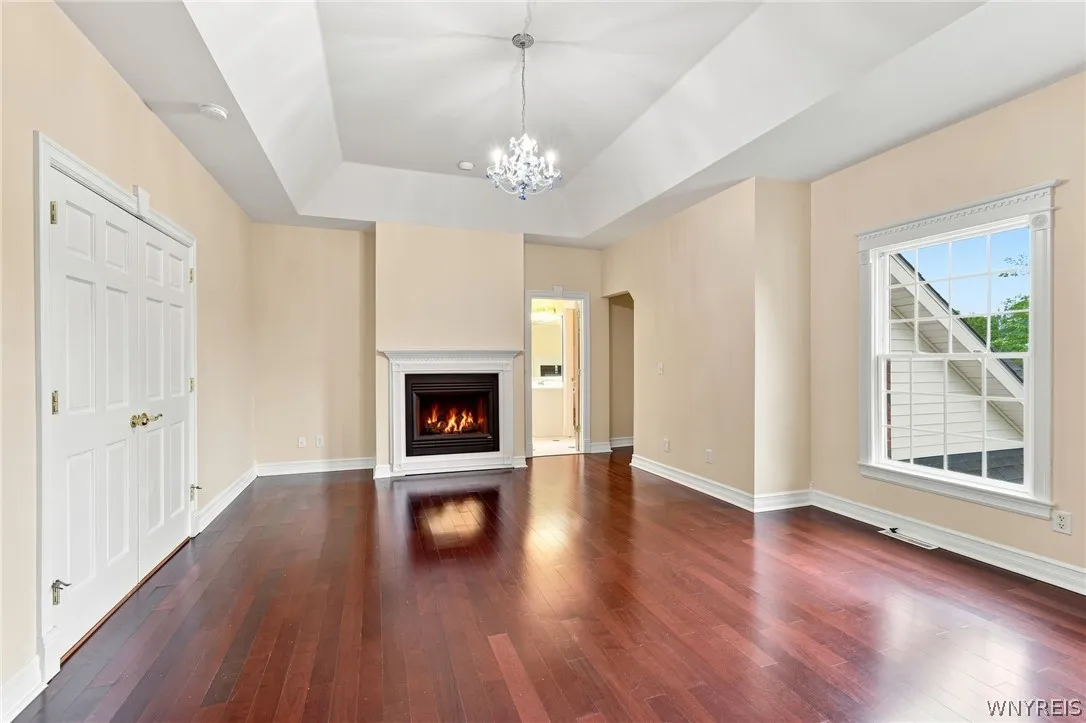 Primary Bedroom has gorgeous double sided fireplace.