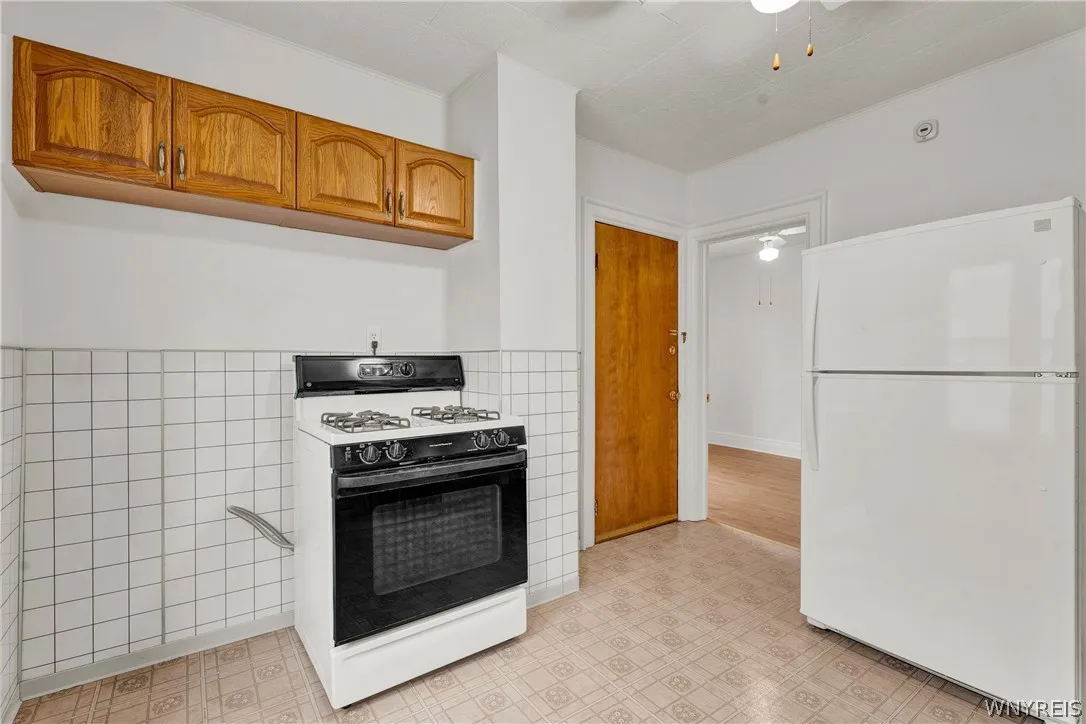 Kitchen looking towards back bedroom/ backdoor