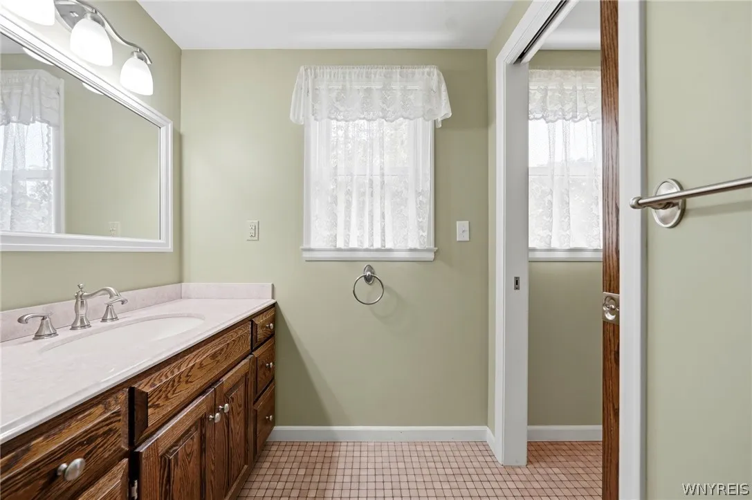 Second floor bathroom with separate shower/toilet area.
