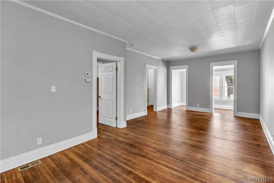 Lower Living/Dining open to Front Sunroom for additional common space.