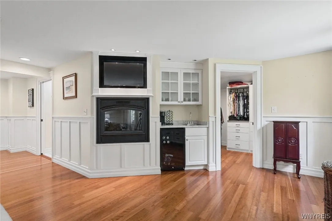Primary fireplace,wet bar, wine ref.