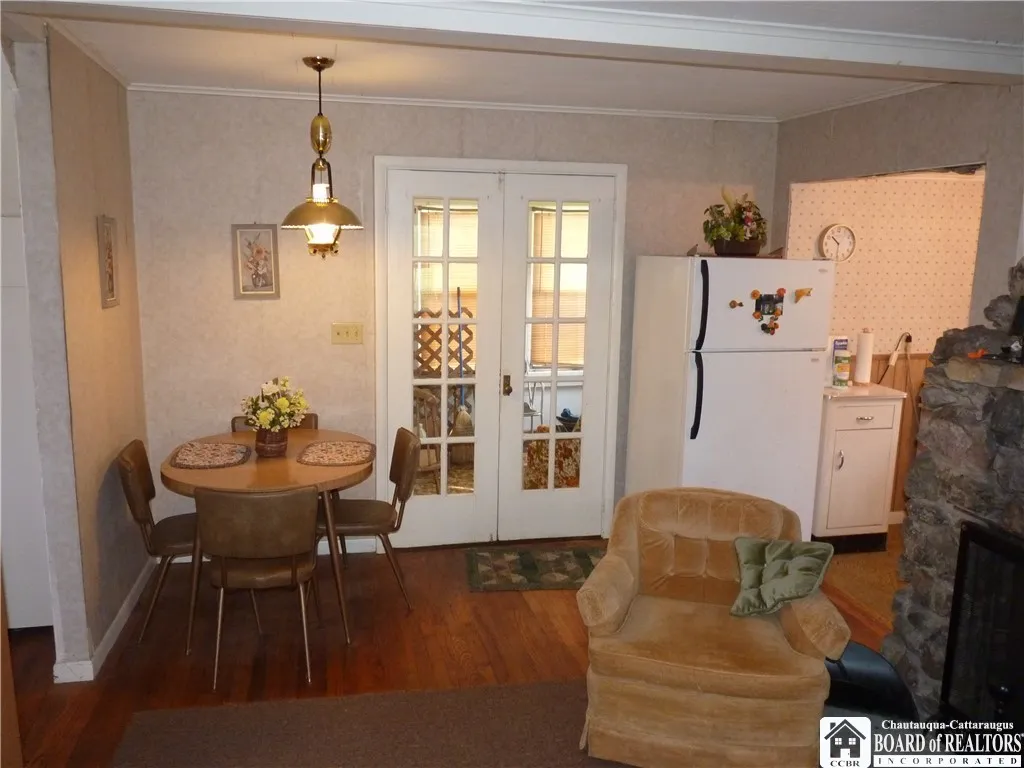 French doors to rear enclosed porch area