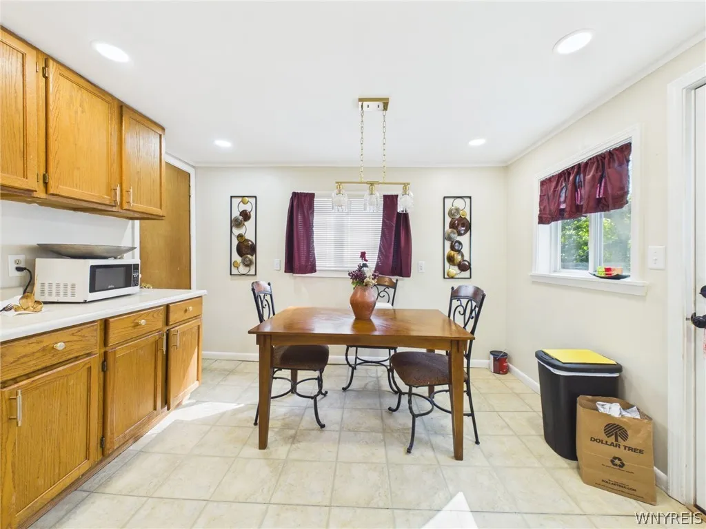 Dining nook: The eat-in area has its own pendant light and two windows.
