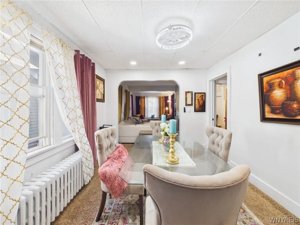 Dining room, second angle: Looking through the archway, you can see how the dining room and living room flow together.