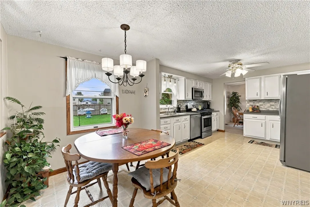 Eat-in Kitchen with Cabinets to Left of Refrigerator Also