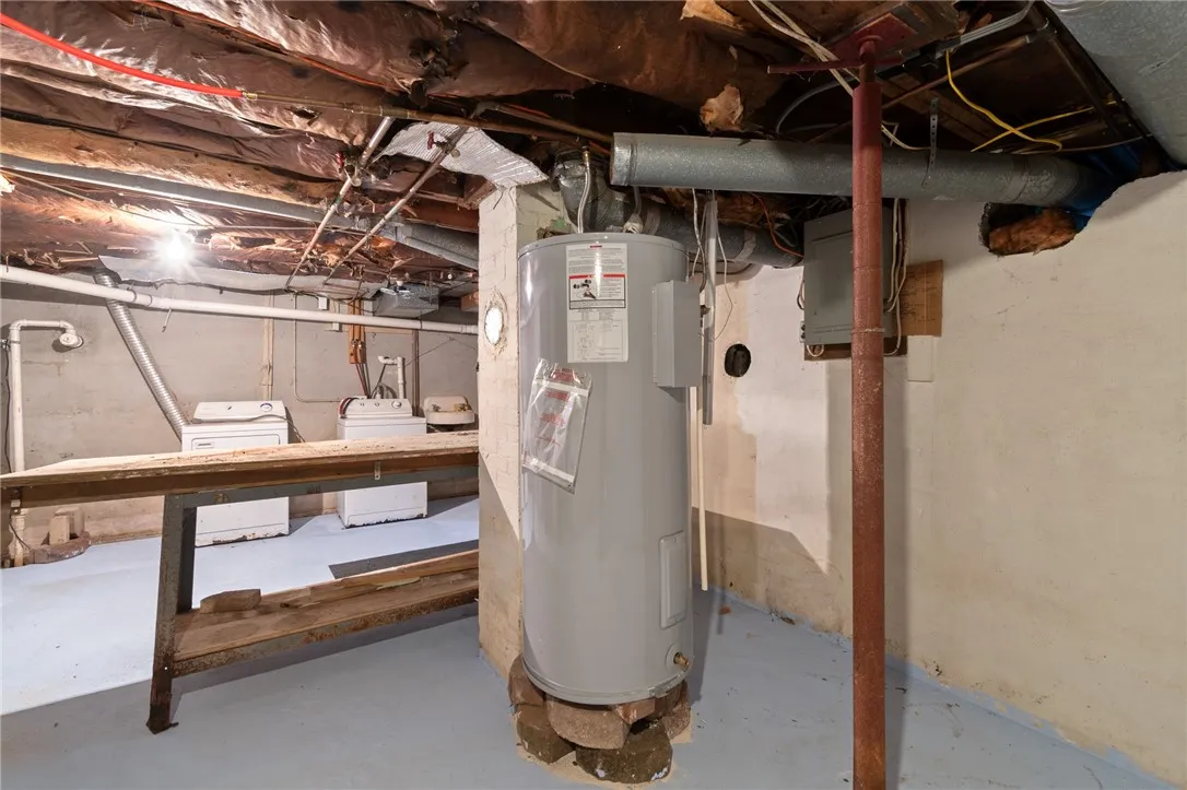 Newer water heater in the FULL BASEMENT/workshop with access to the rear entrance- no going through the living space to access the basement!
