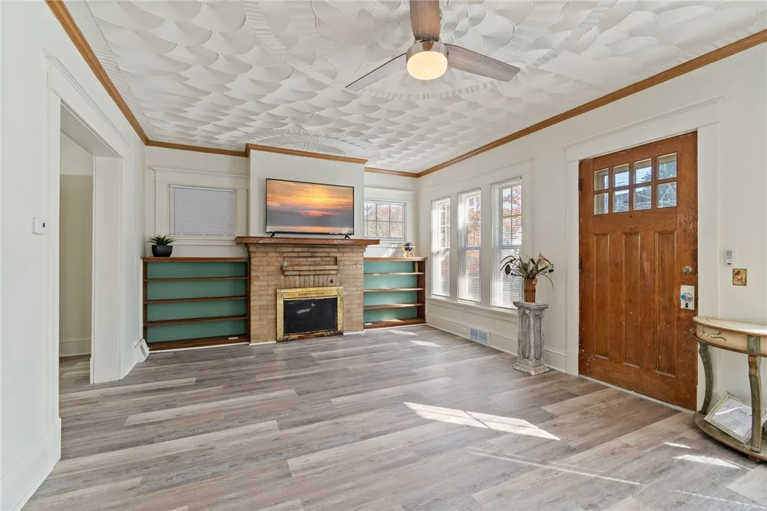 BRIGHT and SPACIOUS! Here is  the living room - there’s even a bonus room off the dining area
