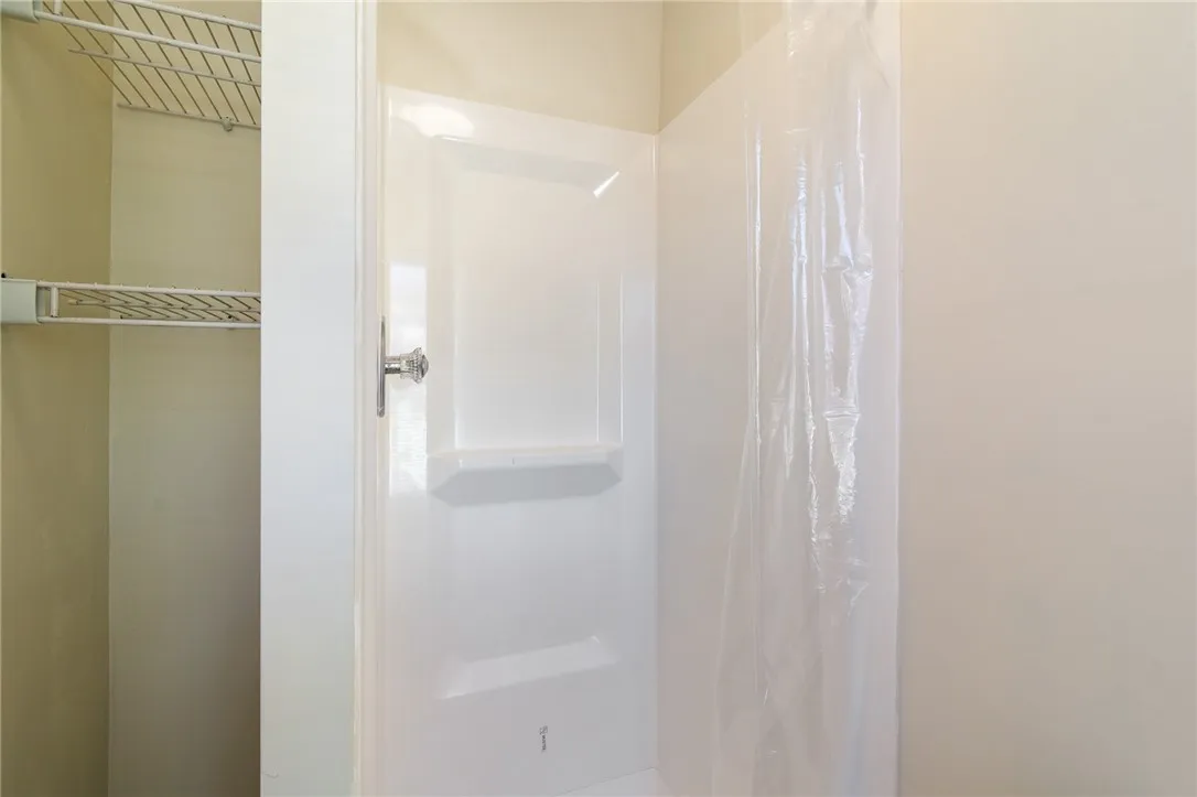 Brand new shower in  one of the THREE FULL BATHS in this home!