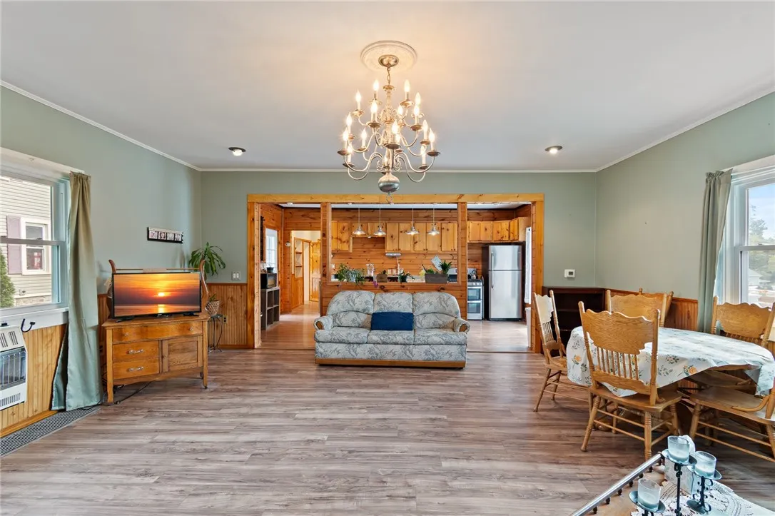 Living room, kitchen in background. Always part of any gathering!