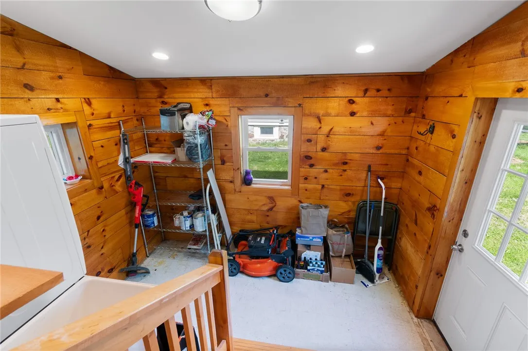 Utility room with door to back.